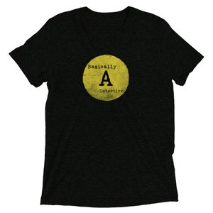 May include: Black t-shirt with a yellow circle graphic that says "Basically A Detective" with a large letter "A" in the center.