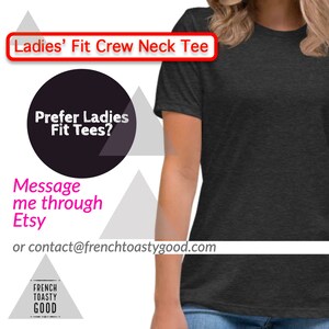 May include: Dark gray crew neck tee shirt. The image includes text that reads "Ladies' Fit Crew Neck Tee" and "Prefer Ladies Fit Tees?" Additional text encourages messaging through Etsy or contacting frenchtoastygood.com.