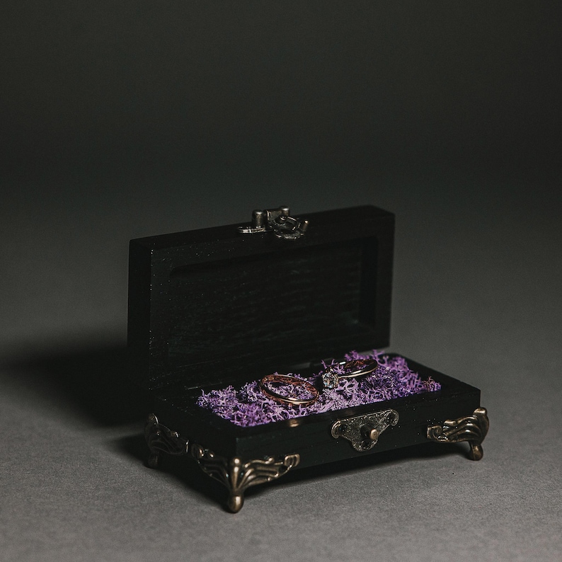 Made from durable wood, with detailed metal legs and a lock, ensuring both beauty and longevity.