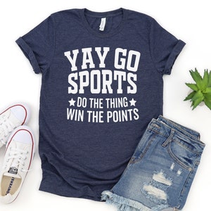 May include: A navy blue t-shirt with white text that reads "YAY GO SPORTS ★DO THE THING★ WIN THE POINTS".