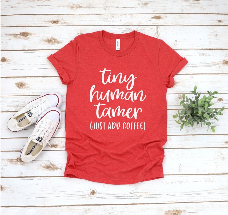 May include: Red t-shirt with white text that reads "tiny human tamer (just add coffee)"