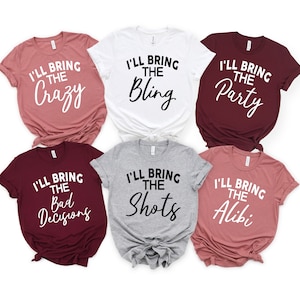 May include: Six t-shirts in different colours with text. The text on the shirts reads "I'll bring the..." followed by "Crazy", "Bling", "Party", "Bad Decisions", "Shots", and "Alibi".