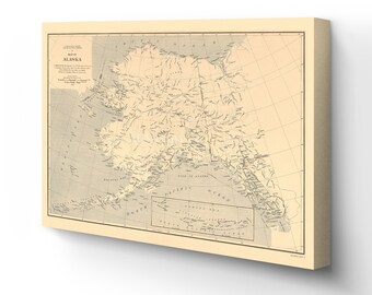 May include: A vintage map of Alaska with detailed geographical features, including rivers, mountains, and cities. The map is printed on a cream-colored background with black text and lines. The title "Map of Alaska" is printed in the top left corner.