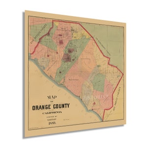 May include: A vintage map of Orange County, California, from 1889. The map is printed on aged paper and shows the county's boundaries, towns, and roads. The map is titled "Map of Orange County, California" and is compiled by Silfiney.