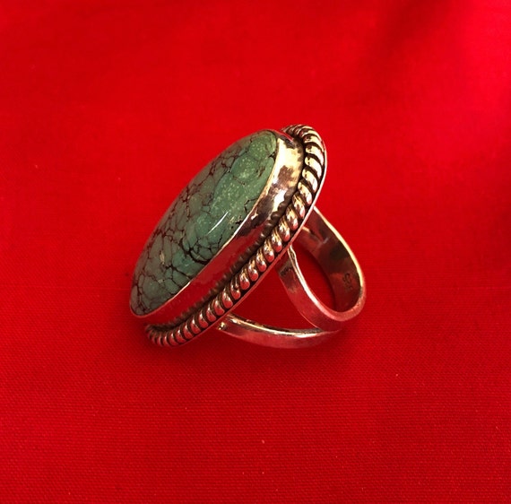 A large and old turquoise and silver ring - image 2