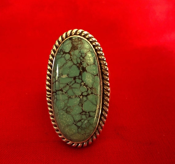 A large and old turquoise and silver ring - image 6