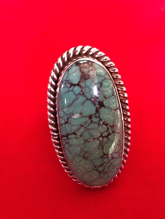 A large and old turquoise and silver ring - image 1