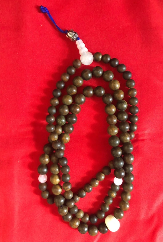 Used and old  green sandal wood prayer bead