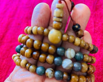 An old and used yak bone prayer beads with  blessings
