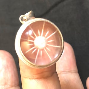 Handmade Clear Quartz Sun Pendant: Silver Amulet from Nepal