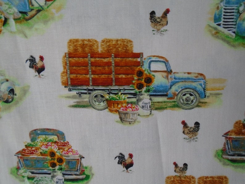 May include: A vintage blue pickup truck with a wooden bed filled with hay bales. The truck is decorated with sunflowers and a milk jug that says "Fresh Milk". There are also roosters and chickens in the image.