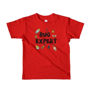 May include: Red short-sleeved t-shirt with a black circle design featuring the text "BUG EXPERT" surrounded by various bug illustrations.