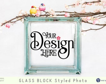 Mockup av fyrkantigt glasblock för hantverkare, stylat foto