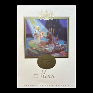 May include: Menu from Canadian National Railways featuring a religious illustration. The image depicts a figure in a boat with another figure, with a building in the background. The menu has text that reads "The Legendary Consecration of the Abbey" and "Menu".