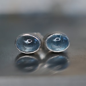 Ice! Aquamarine smooth cabochon earrings set in 925 sterling silver. Beautiful small oval blue 8x6mm studs