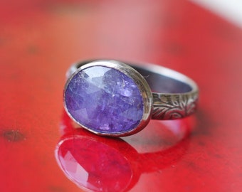 Winter! Custom purple blue tanzanite ring in 925 sterling silver. Patina finish on a pattern band. Periwinkle natural stone