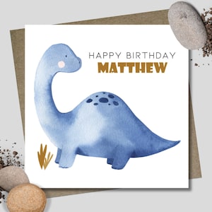 Personalised blue dinosaur birthday card & envelope. 12.5cm sq. card. Customised. All age birthday. First birthday. Boy.
