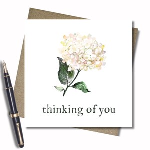 Thinking of you. With sympathy. So sorry. Sending love. Card & envelope. 12.5cm sq. card. White flower. Sympathy. Condolence. Word options.