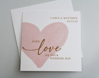 Personalised wedding card & envelope. 12.5cm square card. Customised Bride and Groom pink gold heart. Couple's name date. Modern script.