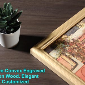 May include: A gold-colored picture frame with a detailed wood grain pattern. The frame is holding a photo of a couple in a garden setting. The text "Concave-Convex Engraved Photo on Wood. Elegant Portrait Customized" is visible at the bottom of the image.