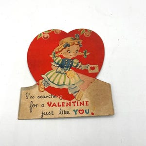 Vintage 1930er Jahre Valentinstag Karte mit einem Kleinen Mädchen das eine Taschenlampe und ein Herz hält