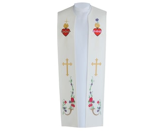 May include: Cream-colored liturgical stole with embroidered religious symbols. Features two golden crosses, two flaming hearts, and floral patterns in red, purple, and green. The stole is worn over a white clerical shirt.