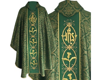 May include: Green liturgical vestment with gold embroidery. The vestment features a floral design and the letters "IHS" in a decorative frame.