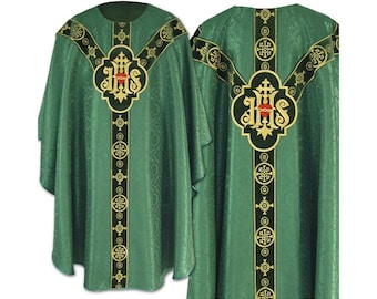 May include: Green liturgical vestment with gold and black embroidered details. The front and back feature a central emblem with the letters IHS and a heart, surrounded by decorative borders and crosses. The fabric has a subtle, repeating pattern.