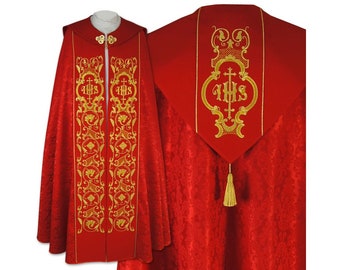 May include: A red liturgical cope with gold embroidery. The cope features a large "IHS" monogram on the back and two smaller "IHS" monograms on the front.