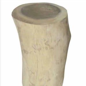 May include: A natural wood stool with a round top and a slightly curved base. The stool is made of light brown wood with a natural finish.