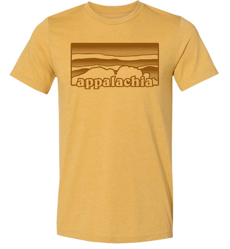 May include: A mustard yellow t-shirt with a brown graphic of a mountain range and the word "appalachia" in a retro font.