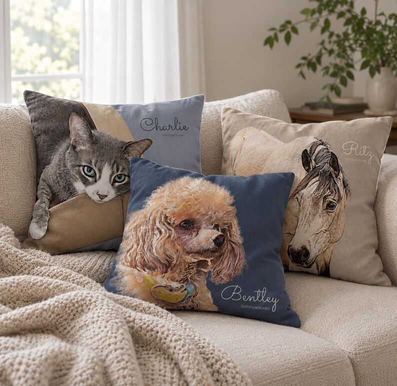 May include: Three square throw pillows featuring custom pet portraits. One pillow shows a gray cat with the name Charlie, one shows a brown poodle with the name Bentley, and one shows a horse with the name Ritz. Each pillow has a unique color scheme.