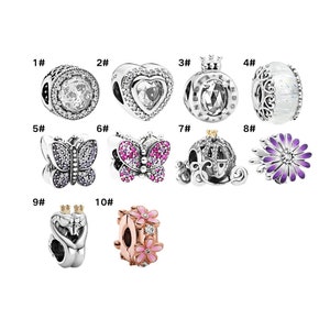 May include: Ten silver charm beads with various designs, including a heart, a crown, a butterfly, a carriage, and a flower. The beads are numbered 1 through 10.