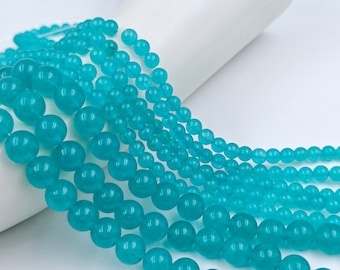 Peut inclure: Un brin de perles rondes bleu turquoise, en pierre naturelle, pour la fabrication de bijoux.