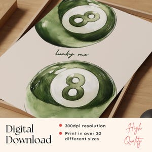 May include: Digital download art print featuring two green and white eight-ball illustrations. The phrase "Lucky me" is written in cursive between the two images. The words "Digital Download" and "High Quality" are also visible.