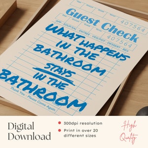 May include: A beige-colored print with blue text that reads "Guest Check" and "What happens in the bathroom stays in the bathroom." The print is in a wooden frame. The words "Digital Download" and "High Quality" are also visible.