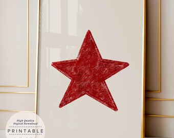Può includere: Una stampa artistica incorniciata che presenta una stella a cinque punte di colore rosso scuro con una texture marcata, centrata su uno sfondo beige chiaro. L'opera è racchiusa in una sottile cornice dorata. Un'etichetta bianca circolare riporta il testo High Quality Digital Download PRINTABLE See Size Guide in Description.