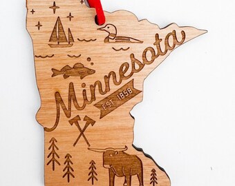 Minnesota keepsake Paul Bunyan ornament complete with loon, fish, sailboat, pine trees and babe