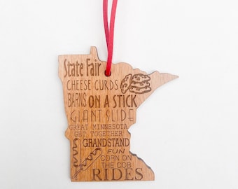 Minnesota State Fair keepsake ornament complete with corn dog, cookies, slide, cheese curds, rides and more