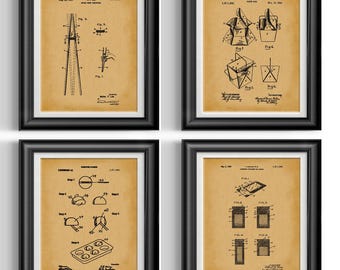 May include: Four framed patent prints with black frames. The prints feature black and white technical drawings on a tan background. The drawings depict various inventions, including a tool, a box, a food container, and a container.