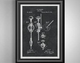 May include: Framed print of a hand drill patent illustration. The black and white diagram shows detailed mechanical components, including gears and a handle. The text reads "I.M. Furbish Hand Drill, Patented May 13, 1884."