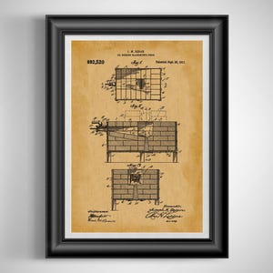 May include: Framed vintage patent print of a coal burning blacksmith's forge. The print features detailed technical drawings and diagrams in black ink on a tan background. The patent number is 692,520, and the patent date is September 30, 1911.