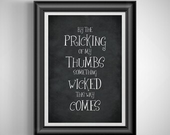 May include: Framed wall art with a black background and white text that reads "By the Pricking of my Thumbs something Wicked this way comes."
