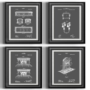 May include: Set of four black framed prints featuring white drawings of various patent designs for a mausoleum. The prints have a grey background and the patent numbers and dates are visible.