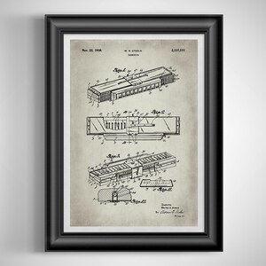 May include: Framed vintage patent print of a harmonica, dated November 22, 1938. The black and white technical drawing shows detailed views of the instrument's internal components and design, with labels and annotations.