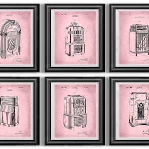 May include: Six framed prints featuring vintage jukebox designs in black ink on a pink background. Each print is in a black frame. The jukeboxes are depicted in a technical drawing style, showcasing their various components and designs.