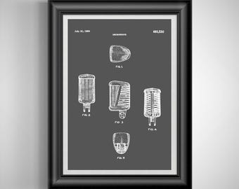 May include: Framed print featuring a vintage microphone patent illustration. The artwork, in white, showcases various microphone designs on a dark gray background. The frame is black.