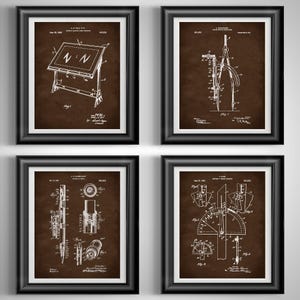 May include: Four framed patent prints featuring architectural and engineering tools. Each print has a white diagram on a brown background, with black frames. The tools include a drafting table, compass, and other instruments.