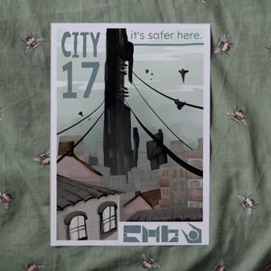 May include: A vintage-style travel poster for City 17, a fictional city from the Half-Life video game series. The poster features a tall, dark building with a cityscape in the background. The text on the poster reads "City 17" and "it's safer here."