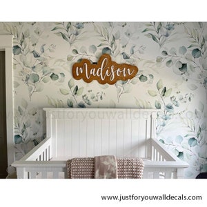 Soothing wallpaper design featuring watercolor eucalyptus branches in gentle shades of green